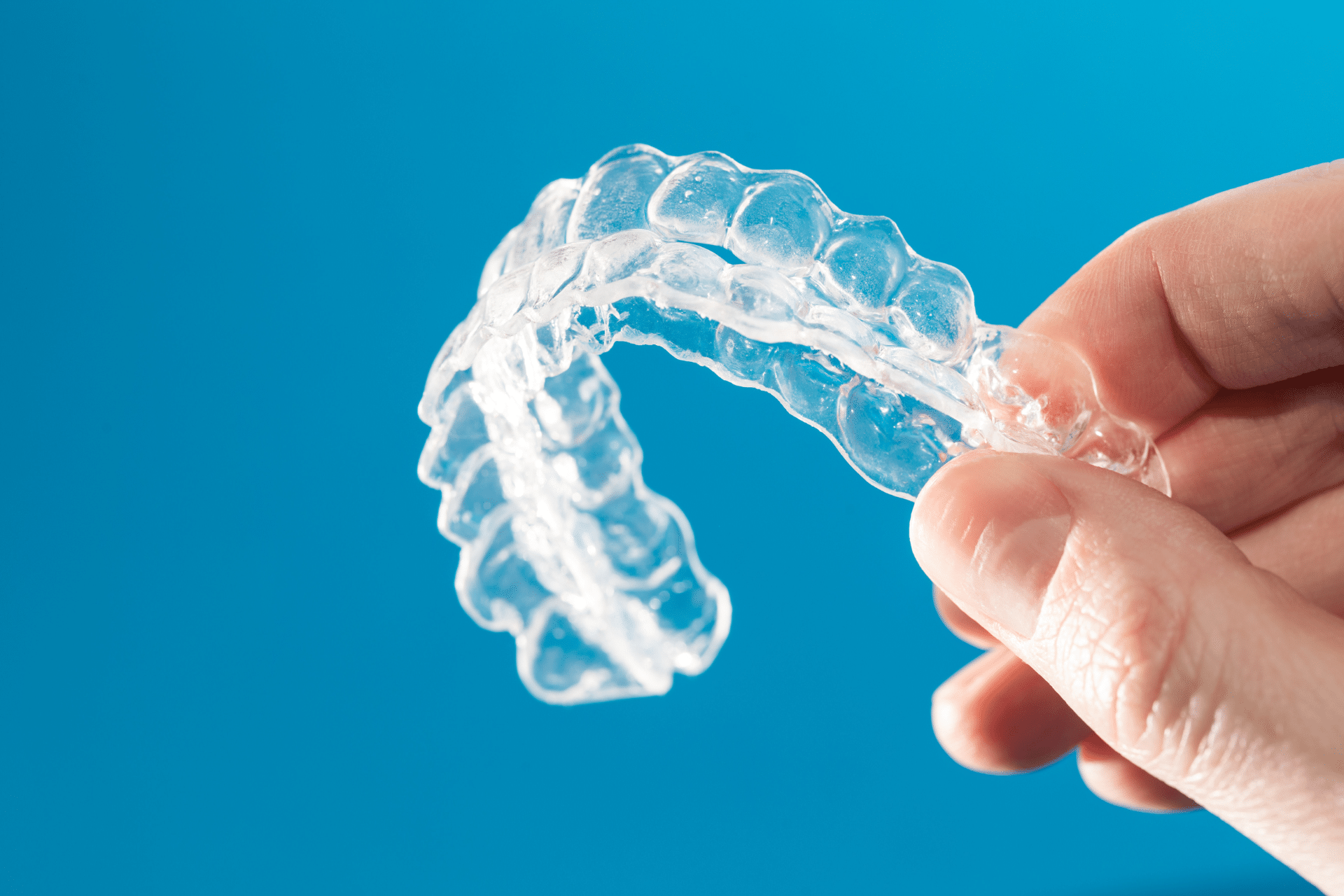 invisalign being hold on hand